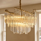 Clérachic close view of the crystal-rod chandelier, clear glass rods hung in layered tiers from a gold-toned frame.