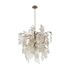 A smaller, round Clérachic chandelier with silver-toned branches and frosted crystal discs on a plain white backdrop.