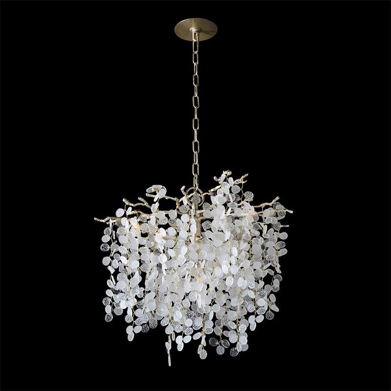 A round, drum-shaped Clérachic chandelier on a black backdrop, with a chain, a ceiling plate and many frosted crystal discs.