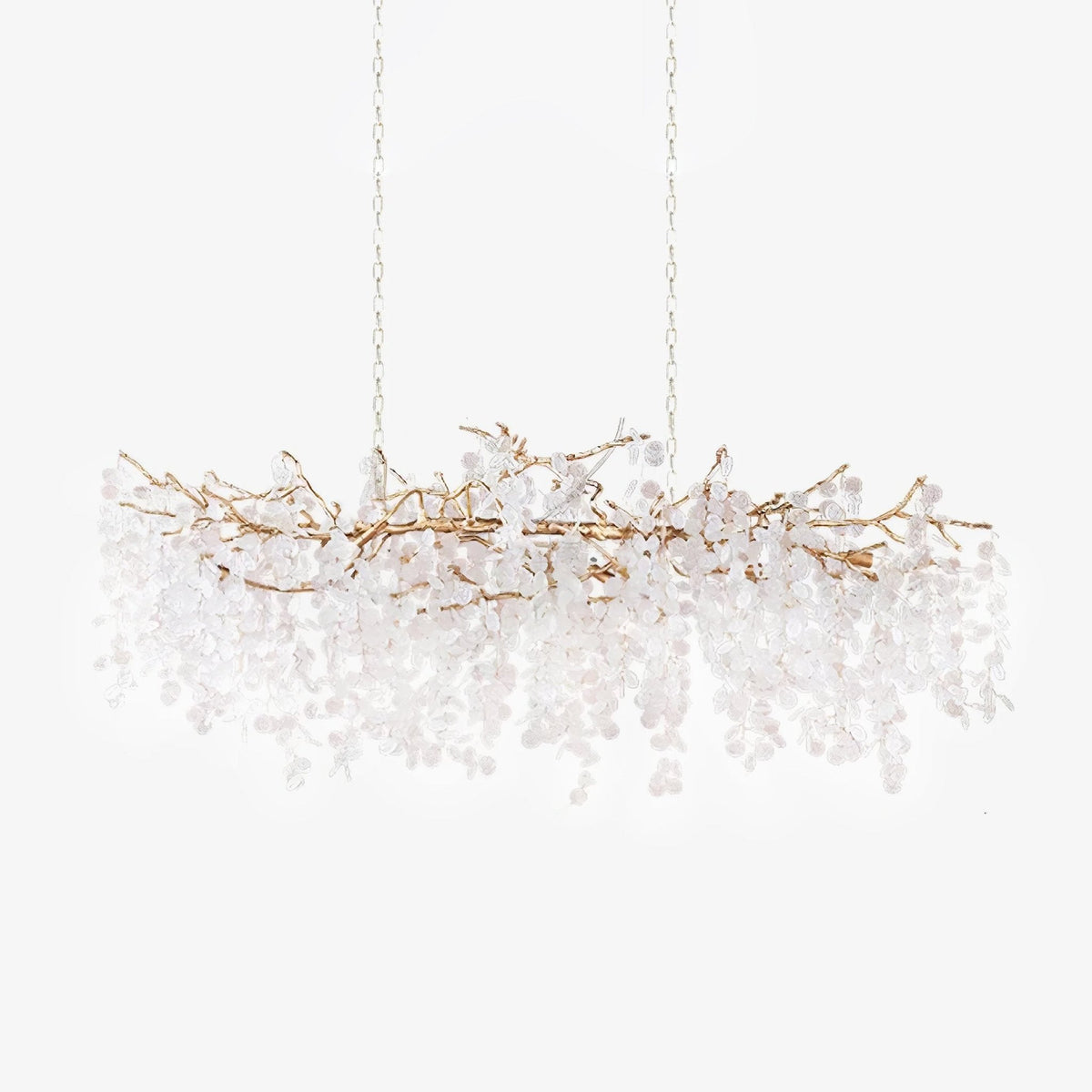A long Clérachic chandelier on a white backdrop, hung from two thin chains with a pale branch frame and crystal discs.