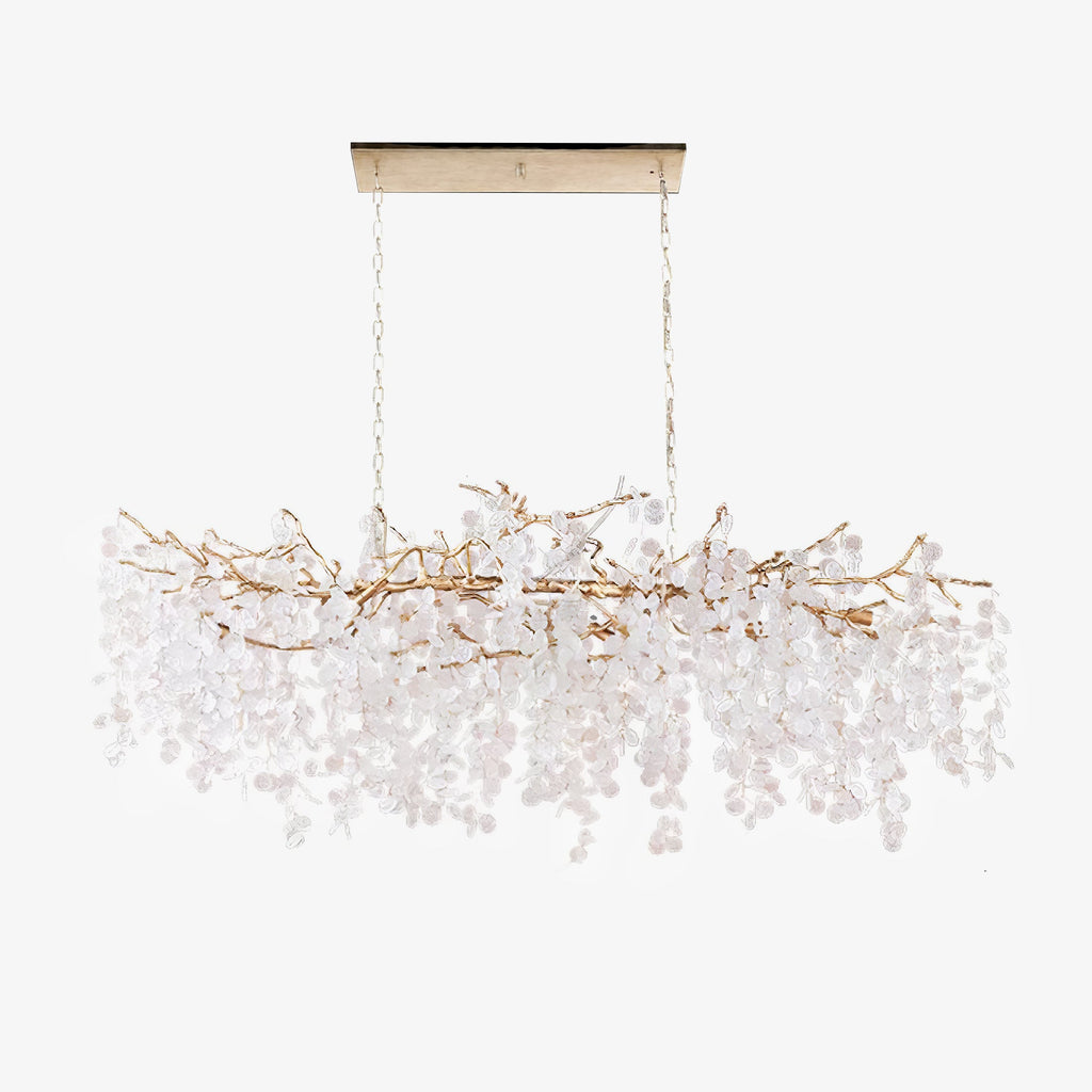 A long Clérachic chandelier on a white backdrop, hung from a slim canopy plate, with the crystal discs a pale frosted white.