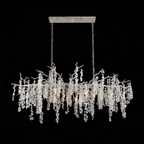 Clérachic long chandelier on a black backdrop, shown with its pale nickel-coloured frame and rectangular canopy plate.