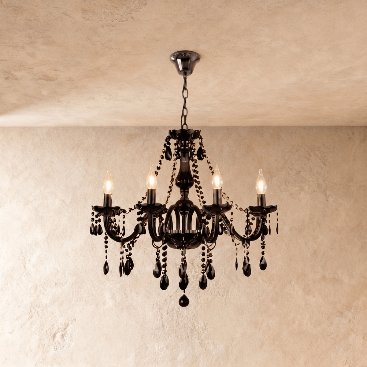 Clérachic chandelier in black glass hangs from a chain, its faceted drops catching the light.