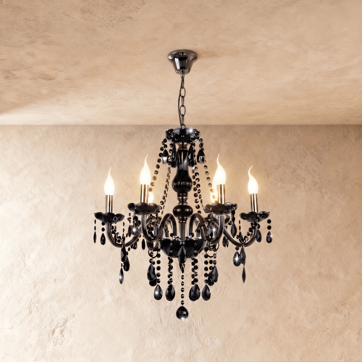 A studio view of the Clérachic chandelier's six black glass arms, lit candle bulbs and beaded crystal chains on show.