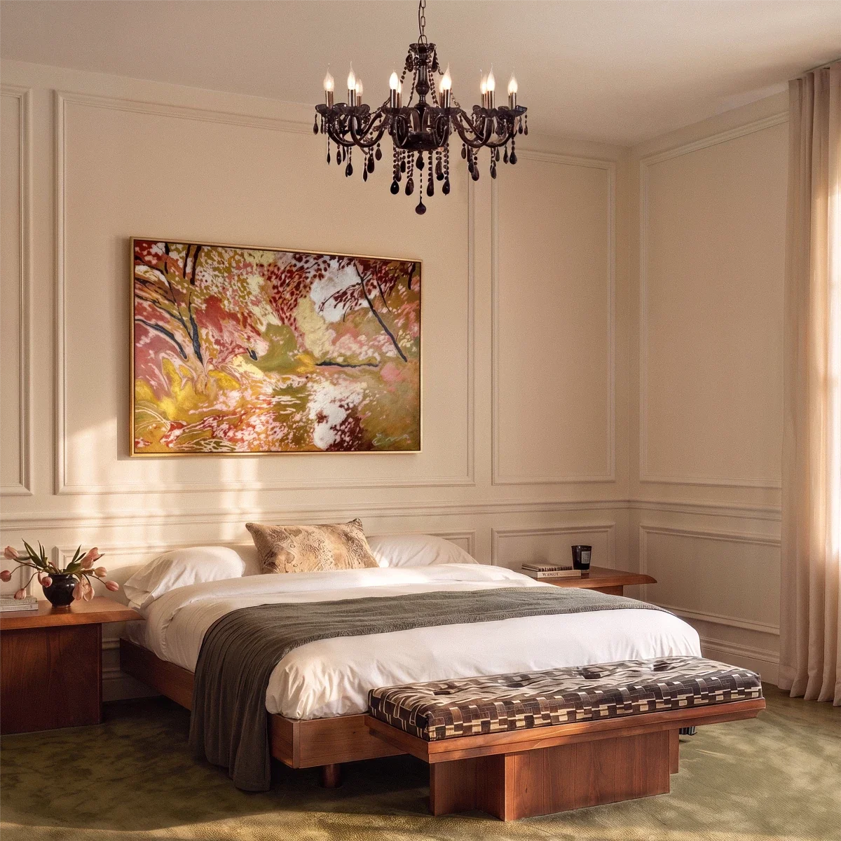 A Clérachic chandelier in black glass hangs above a bed, framed by a warm painted bedroom.