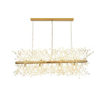 Product shot of a gold-finish rectangular bar pendant with branches drooping from its frame, a different Clérachic fixture from this chandelier.
