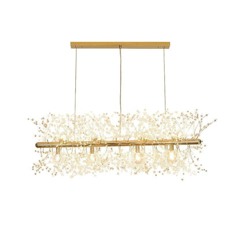 Product shot of a gold-finish rectangular bar pendant with branches drooping from its frame, a different Clérachic fixture from this chandelier.