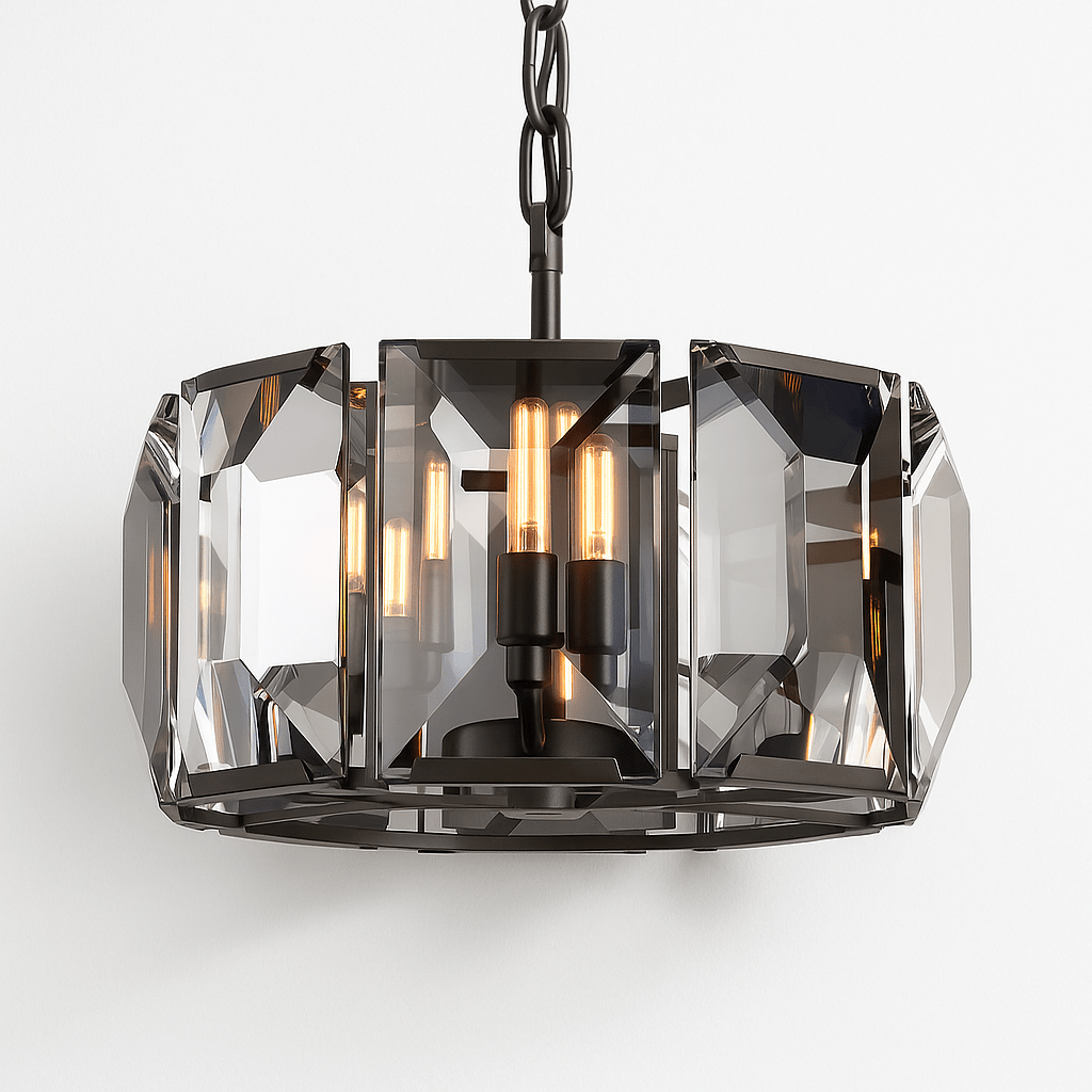 Clérachic black-framed drum chandelier lit warm, filament bulbs glowing through large smoky bevelled crystal panes on a chain.