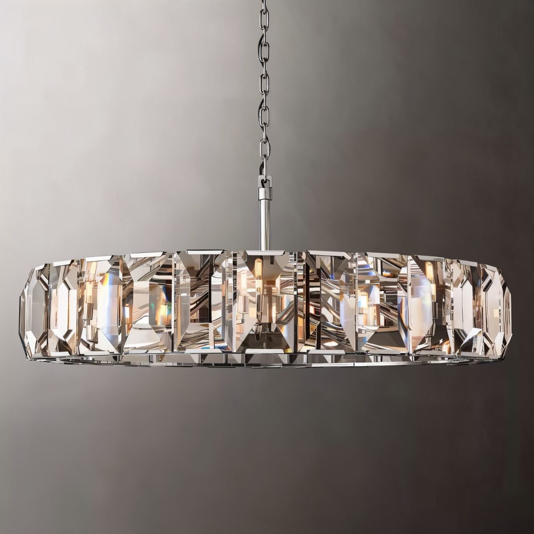 Clérachic polished steel ring chandelier of tall faceted crystal panes, steel chain and rod, shown on a grey backdrop.