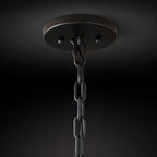 Clérachic matte black ceiling canopy with a chain link and hook, seen from below against a dark backdrop.