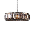 Clérachic black-framed ring chandelier with smoky crystal panes, lit warm and shown cut out on a white background.
