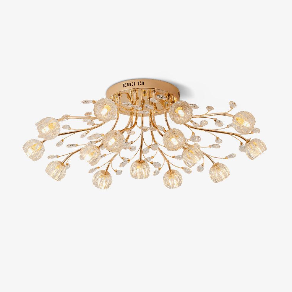 Gold flush ceiling light from Clérachic with branching stems, small crystal leaves and clear glass flower shades, on a plain white backdrop.