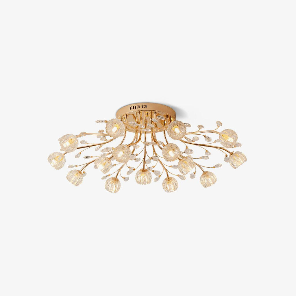 Gold flush-mount Clérachic ceiling light with clear glass flowers and crystal leaves, shown on a white backdrop.