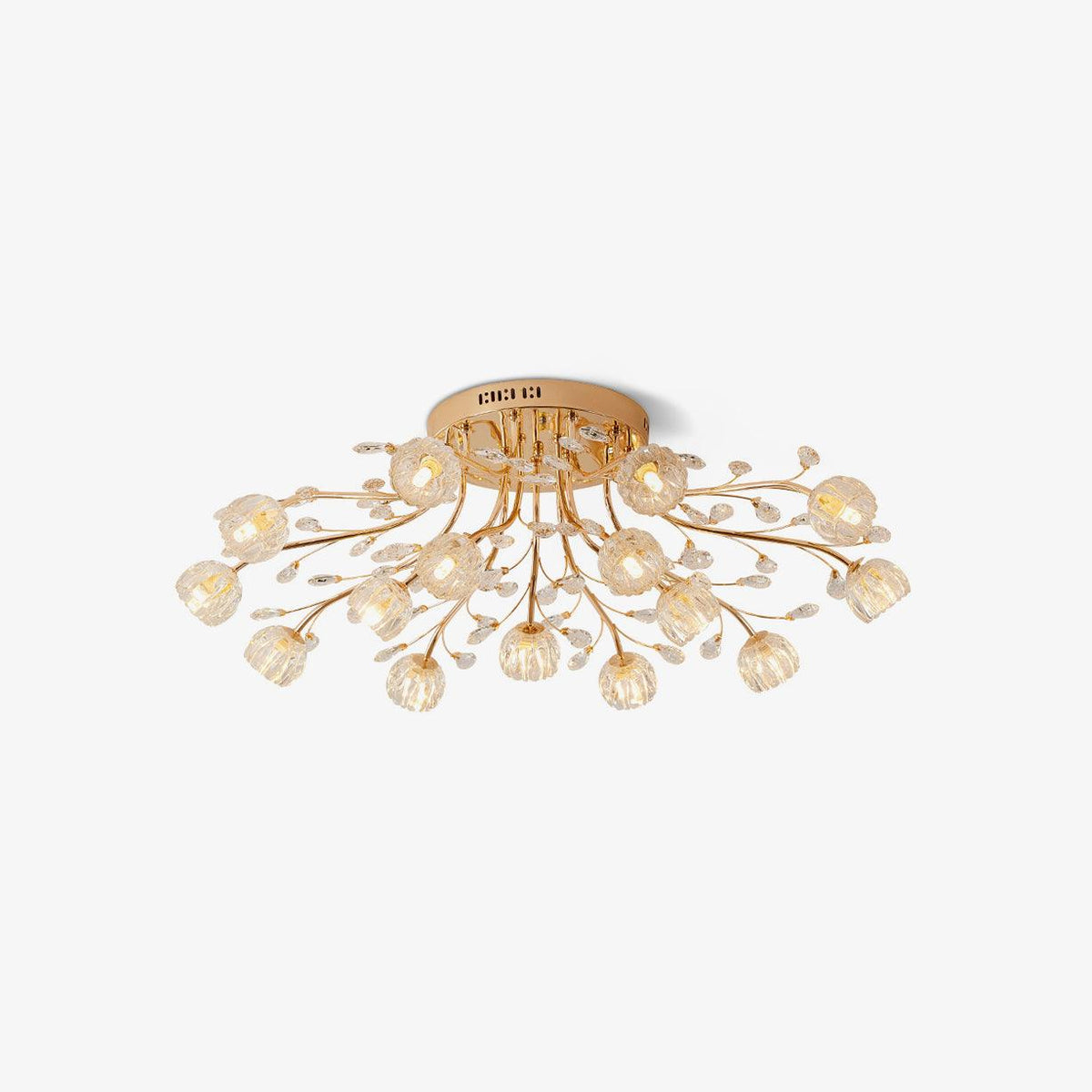 Gold flush-mount Clérachic ceiling light with clear glass flowers and crystal leaves, shown on a white backdrop.