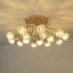 Side view of a lit gold Clérachic ceiling light with a dozen ribbed glass flower shades and a round gold canopy.