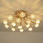 Lit gold ceiling light from Clérachic with ribbed glass flower shades, crystal drops and a warm patterned glow overhead.