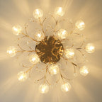 Underside view of a lit gold Clérachic ceiling light, with glass flower shades on slim branches around a round gold canopy.