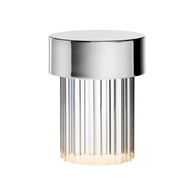 Large view of a Clérachic lamp with a polished chrome cap and deep vertical flutes in the glass, on white.