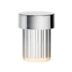 Large view of a Clérachic lamp with a polished chrome cap and deep vertical flutes in the glass, on white.