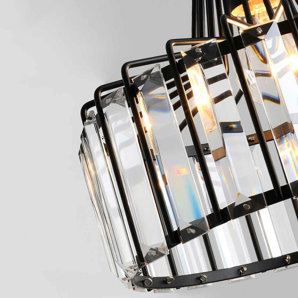 Detail of the black metal frame, riveted fixings and clear glass prisms on this Clérachic drum pendant, seen from below.