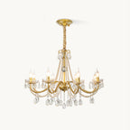This Clérachic crystal chandelier on a plain white backdrop, with gold arms, strands of pearl beads and teardrop crystals below.