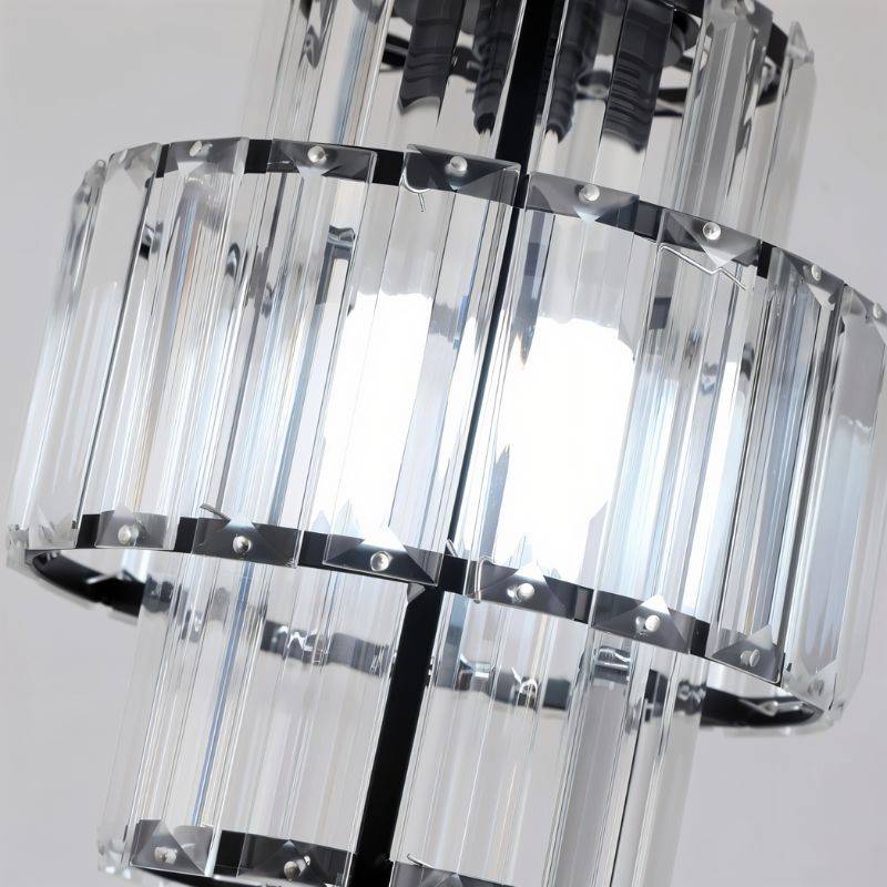 Close crop of a Clérachic black-framed pendant showing its faceted glass bars, rivets and tiered rings.