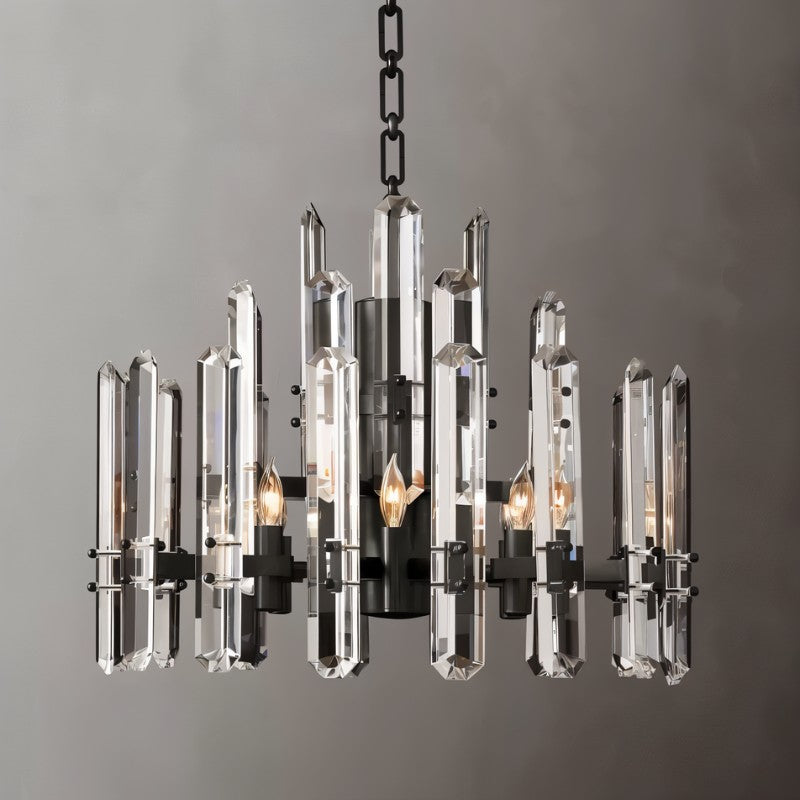 Clérachic round chandelier of faceted clear crystal rods on a matte black frame with candle-style bulbs, on a grey ground.
