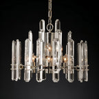 Clérachic round chandelier of faceted clear crystal rods on a polished nickel frame with candle bulbs, on a black ground.