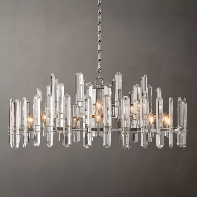 Clérachic widest round chandelier of clear crystal rods on a polished nickel frame, with candle bulbs, on a grey ground.