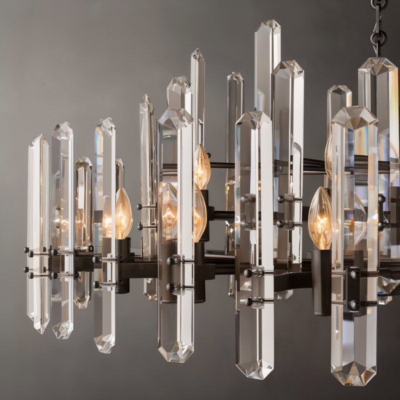 Clérachic close view of crystal rods, matte black arms and candle-style bulbs on a round chandelier.