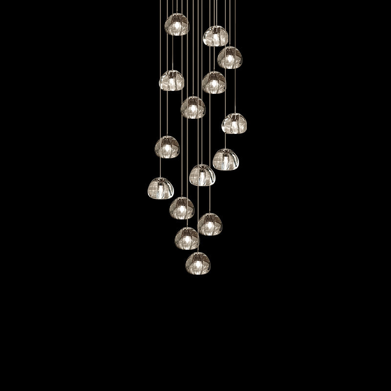 Fifteen or so clear glass heads on this Clérachic pendant hang in a loose column against black.