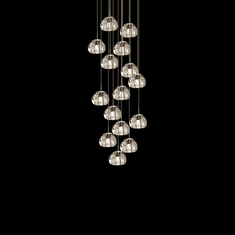 About fifteen clear glass heads from this Clérachic pendant hang on cords in a loose cluster against black.