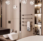 In a beige bathroom with a heated towel rail, this Clérachic pendant's clear glass heads hang at the top of the frame.