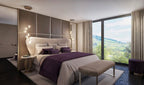 In a bedroom with purple bedding and a large window, this Clérachic pendant hangs by the bedside in a small group.
