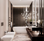 Over a freestanding bath in a dark-panelled bathroom with stone flooring, this Clérachic pendant hangs as a cluster of clear glass heads.