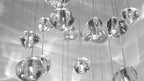 A wide crop of clear glass heads on this Clérachic pendant, in grey tones, with fine wires and soft reflections of light.