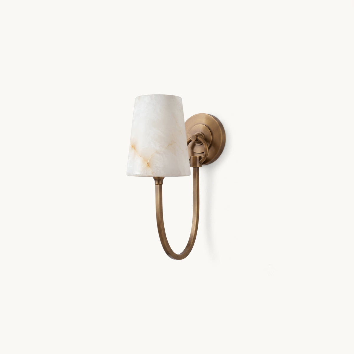 Single alabaster-shade wall sconce on an antique bronze round backplate with a curved arm, from Clérachic, on a plain white backdrop.