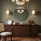 A pair of single-light Clérachic alabaster sconces flank a round mirror above a walnut sideboard against green damask wallpaper.