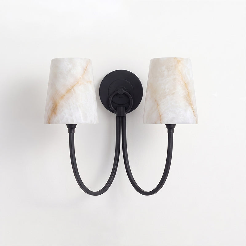 Two-light black sconce from Clérachic, its alabaster shades showing amber veining above two looped black arms.