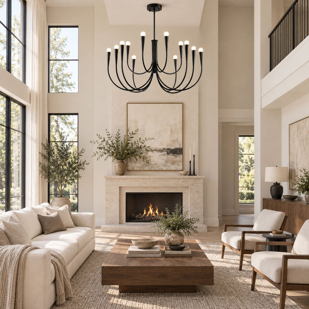 Black Clérachic chandelier hung in a tall living room, above a stone fireplace, a cream sofa and a low wooden coffee table.