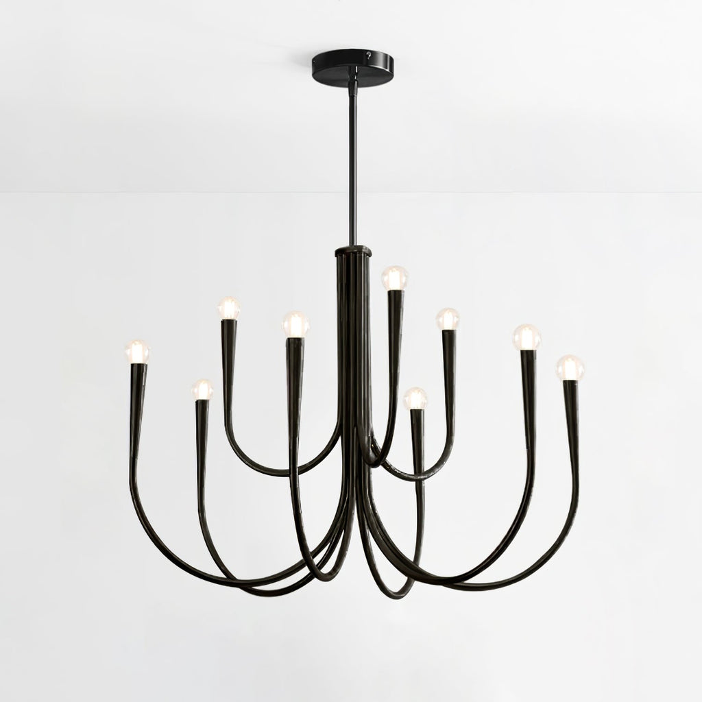 Black Clérachic chandelier with two tiers of long looping arms, on a plain light backdrop with a round black canopy.