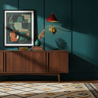 Small red-shaded Clérachic wall light on a teal panelled wall, above a walnut sideboard with a framed abstract print and a patterned rug.