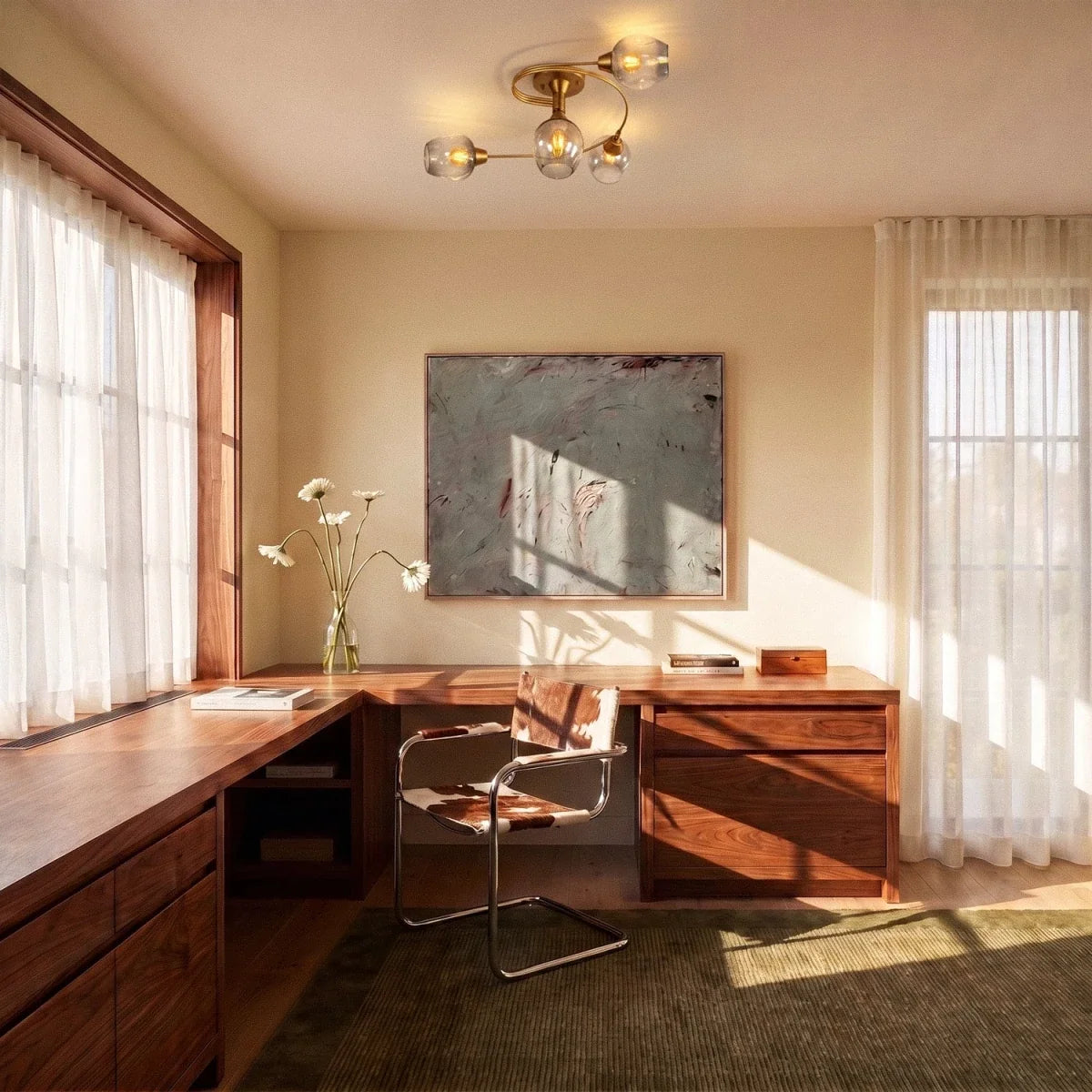 Clérachic gold ceiling light with four curved arms and glass shades above a walnut desk in a bright, sunlit study.