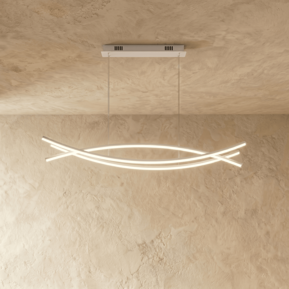 Clérachic long LED chandelier with three crossing curved light bars hung on thin cords from a rectangular canopy, lit warm.