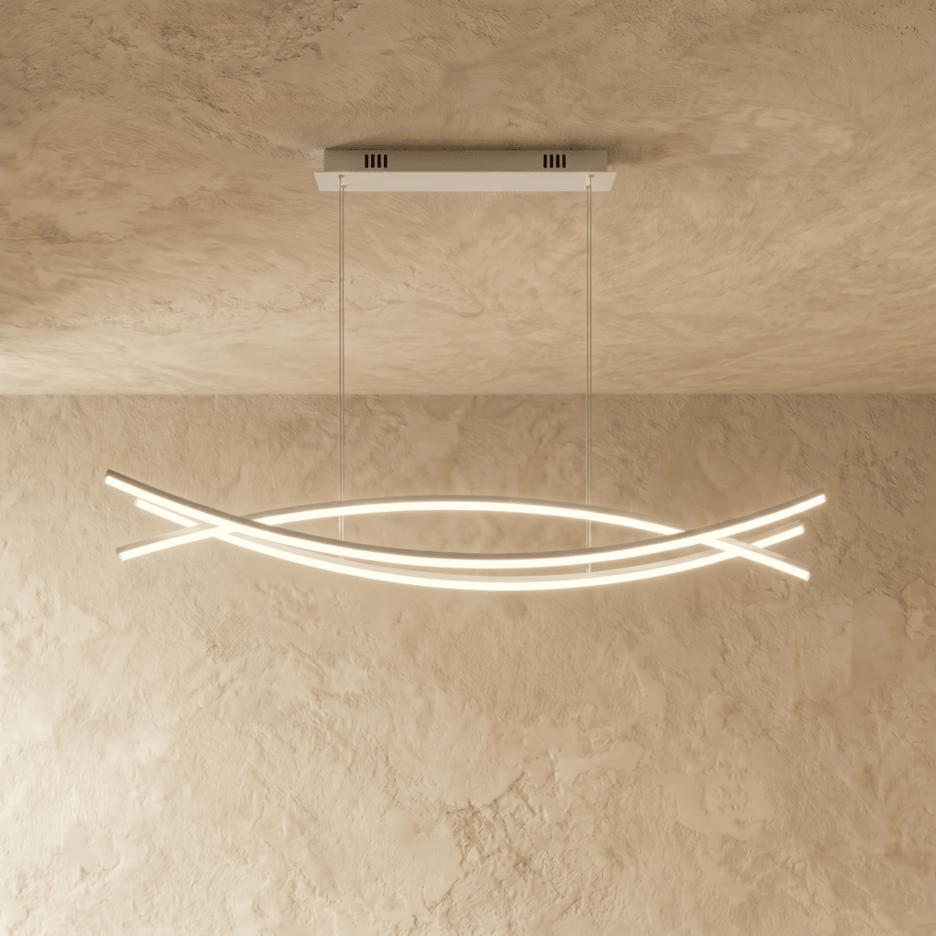 Clérachic long LED chandelier in a longer length, its crossing curved light bars glowing below a slim rectangular canopy.