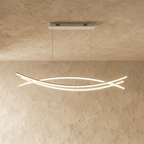 Clérachic long LED chandelier in a longer length, its crossing curved light bars glowing below a slim rectangular canopy.