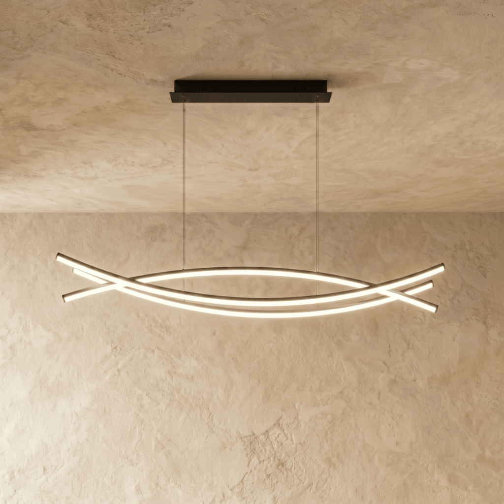 Clérachic long black LED chandelier with crossing curved light bars, hung from a black rectangular canopy on a limewash ceiling.