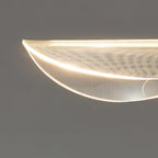 Close view of the lit edge of the clear acrylic shade on this Clérachic pendant, showing its fine dot pattern and glowing rim.