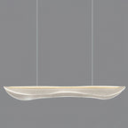 Unlit Clérachic linear pendant with a clear, wavy acrylic shade on two thin cables, against a plain grey backdrop.