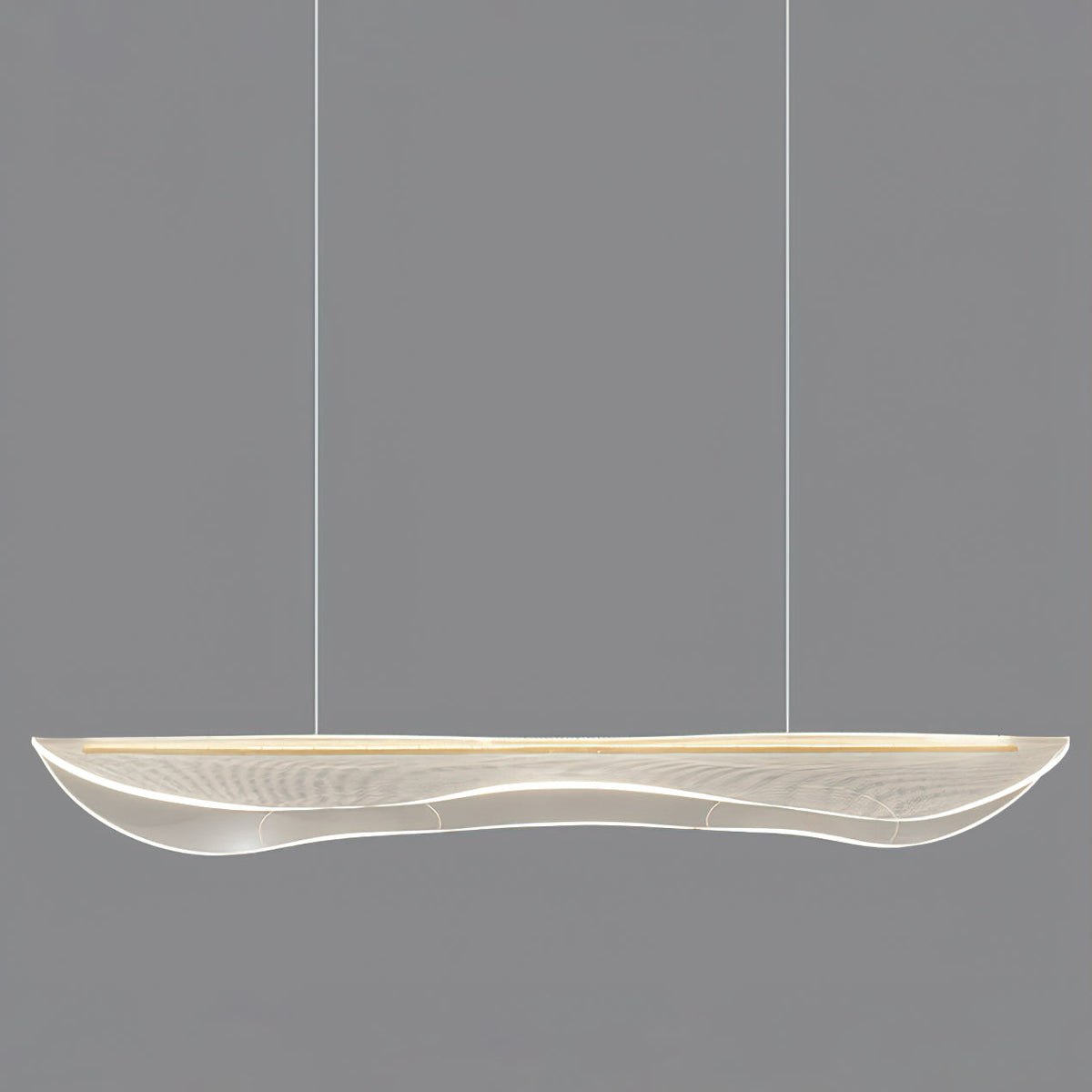 Unlit Clérachic linear pendant with a clear, wavy acrylic shade on two thin cables, against a plain grey backdrop.